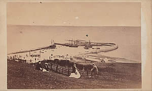 Distant view of the Cobb at Lyme Regis, probably 1870s